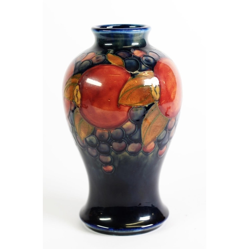 105 - WILLIAM MOORCROFT POMEGRANATE POTTERY TUBE LINED POTTERY VASE, of baluster form, decorated in tone o... 