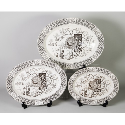 12 - MINTON'S AESTHETIC MOVEMENT graduated trio of oval plates, with brown printed Faisant pattern