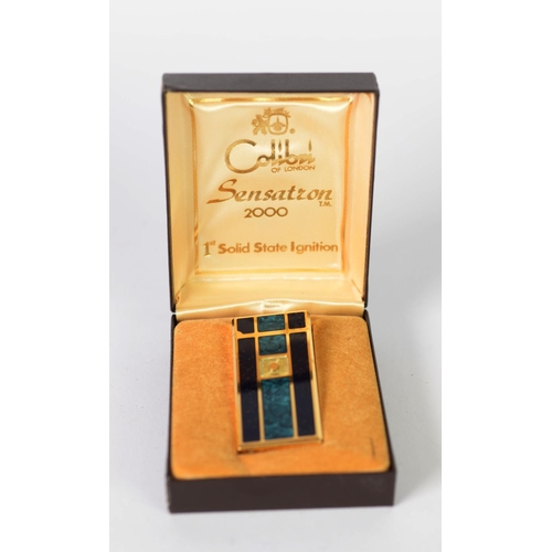 380 - COLIBRI SENSATION 2000 POCKET CIGARETTE LIGHTER, gilt metal and enamels in fitted case, (base of lig... 