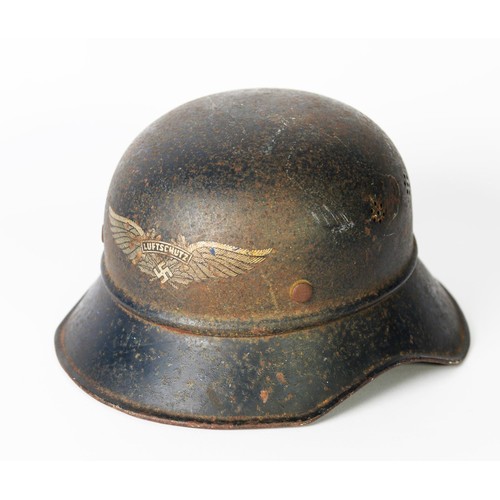 56 - GERMAN M1938 LUFTSCHUTZ GLADIATOR HELMET, probably retaining 60/70% of original dark blue paint and ... 