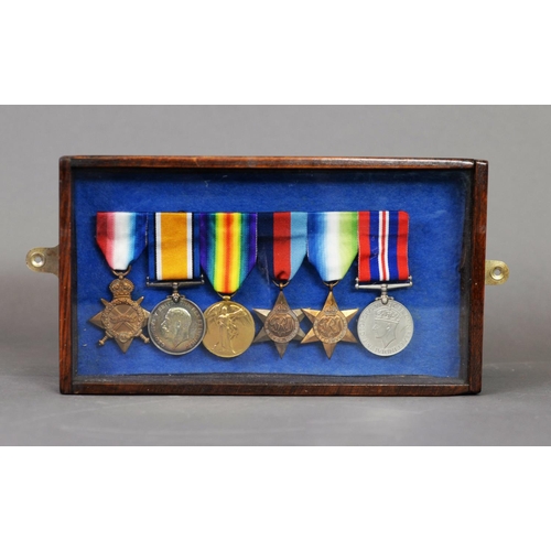 57 - SMALL SLIDE FRONT WOOD AND GLAZED DISPLAY CASE CONTAINING SIX SERVICE MEDALS, WITH RIBBONS, three Wo... 