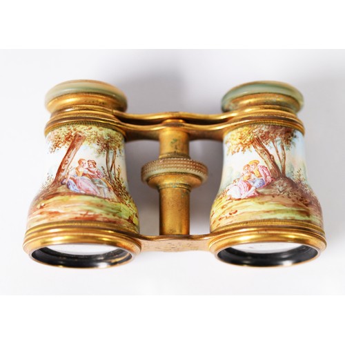 388 - PAIR OF 19th CENTURY FRENCH GILT BRASS OPERA GLASSES, with mother of pearl inset eye pieces, the bod... 