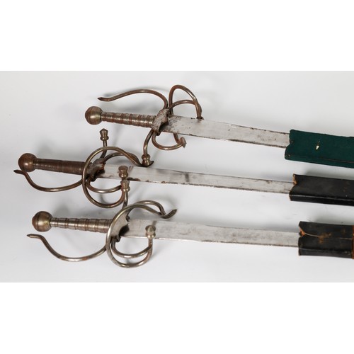 92 - THREE REPRODUCTION ALL STEEL MEDIAEVAL STYLE BROADSWORDS, the largest 40in (101.5cm) long overall, e... 