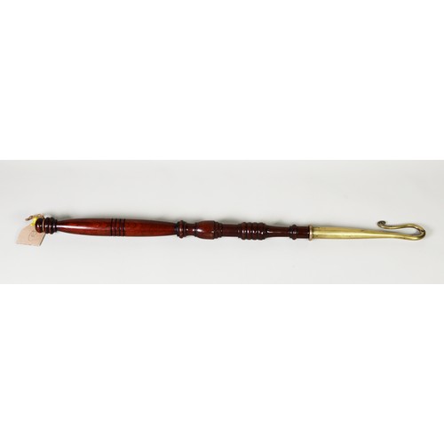 446 - LATE VICTORIAN TURNED MAHOGANY AND BRASS IMPLEMENT, turned mahogany staff with a brass shepherd's cr... 