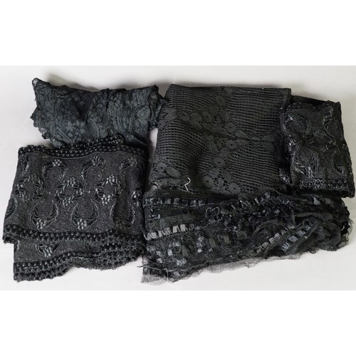 BLACK AND FLORAL PATTERN LACE SHAWL of long triangular form; a QUANTITY ...