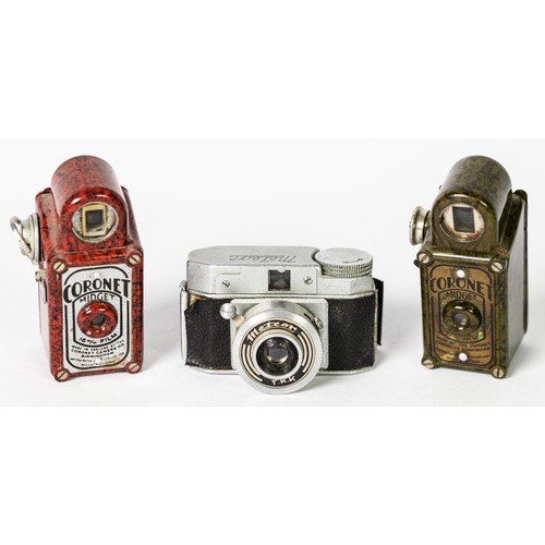 289 - RED BAKELITE CORONET MIDGET SUB-MINIATURE CAMERA, plus another in brown and a Meteor TKK [3]