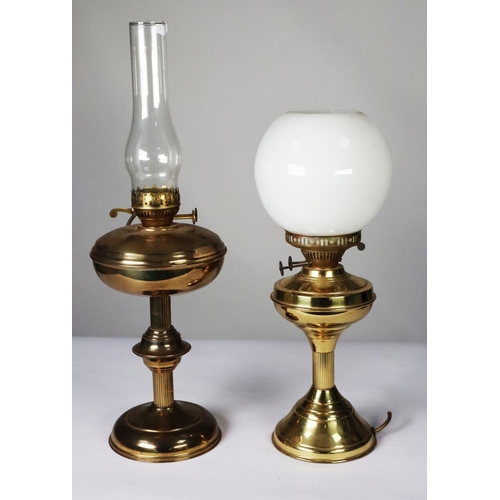 115 - TWO BRASS OIL PATTERN TABLE LAMPS, one with orbicular white glass shade (base of the lamp cracked), ... 