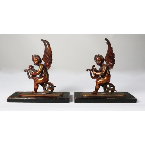 119 - PAIR OF PATINATED BRONZE FIGURES OF WINGED PUTTO, each modelled playing a lyre and sat on a winged w... 