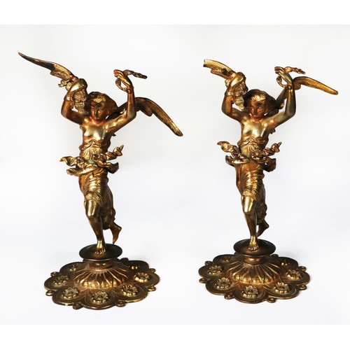 120 - NEAR MATCHING PAIR OF RUSSIAN STYLE GILT METAL FIGURES, each modelled as a semi naked, winged female... 