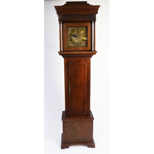 57 - LINE INLAID OAK LONGCASE CLOCK, the 11 ½” brass dial with matted centre and pierced spandrels, power... 