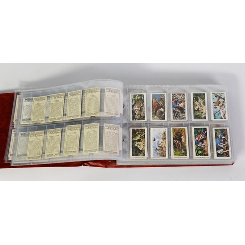 121 - RING BINDER CONTAINING TEN SETS OF JOHN PLAYERS CIGARETTE CARDS including sets of military interest,... 