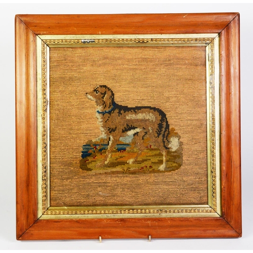 313 - LATE 19th CENTURY WOOLWORK PICTURE OF HOUND, IN MULTI-COLOURS, beside a lake or river, centred on a ... 