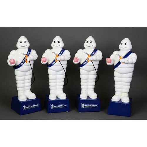 263 - FOUR LATE 20th CENTURY MOULDED COMPOSITION MR MICHELIN/BIBENDUM STANDING FIGURE MONEY BANKS in the f... 