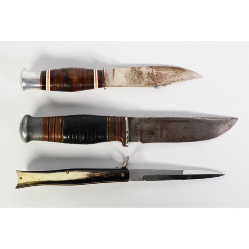 216 - TWO SCOUT KNIVES, in leather sheaths and a CLASP KNIFE with horn mounted handle