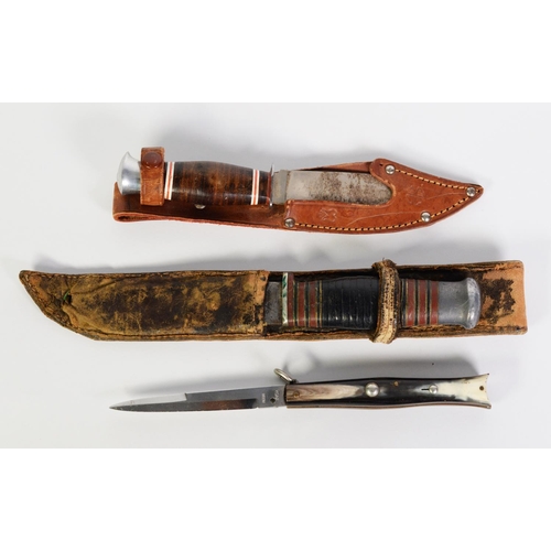 216 - TWO SCOUT KNIVES, in leather sheaths and a CLASP KNIFE with horn mounted handle