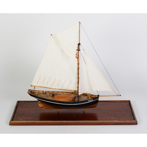 80 - PAINTED WOOD MODEL OF THE SCILLY ISLES FISHING BOAT AGNES, under full sail, with solid wooden hull, ... 