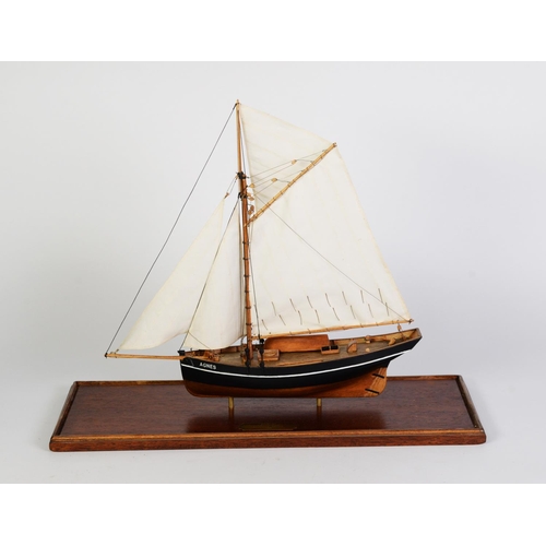 80 - PAINTED WOOD MODEL OF THE SCILLY ISLES FISHING BOAT AGNES, under full sail, with solid wooden hull, ... 