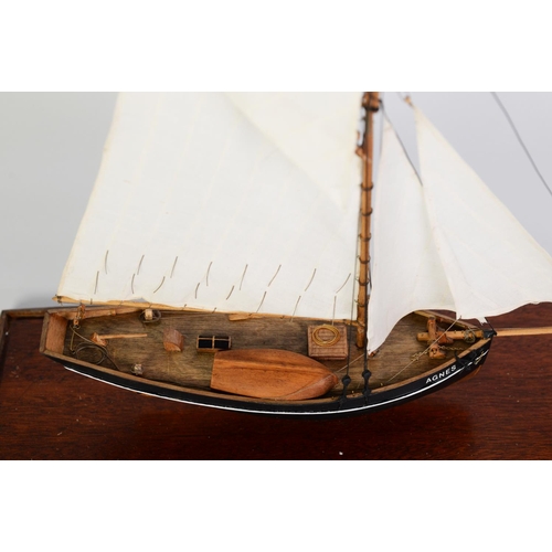 80 - PAINTED WOOD MODEL OF THE SCILLY ISLES FISHING BOAT AGNES, under full sail, with solid wooden hull, ... 