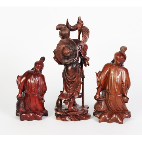 239 - THREE CHINESE ROOT CARVINGS, two as seated fisherman (lacking rods) and another of a fisherman stepp... 