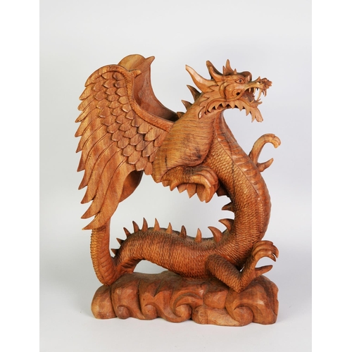 245 - LARGE SOUTH-EAST ASIAN WOOD CARVING OF A REARING WINGED DRAGON, on cloud carved base, 19 ½” (49.5 cm... 