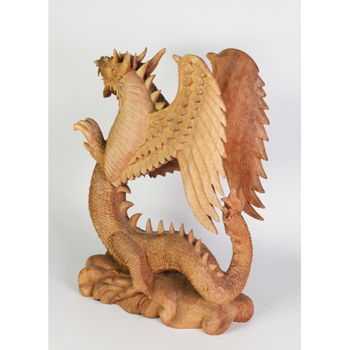 245 - LARGE SOUTH-EAST ASIAN WOOD CARVING OF A REARING WINGED DRAGON, on cloud carved base, 19 ½” (49.5 cm... 