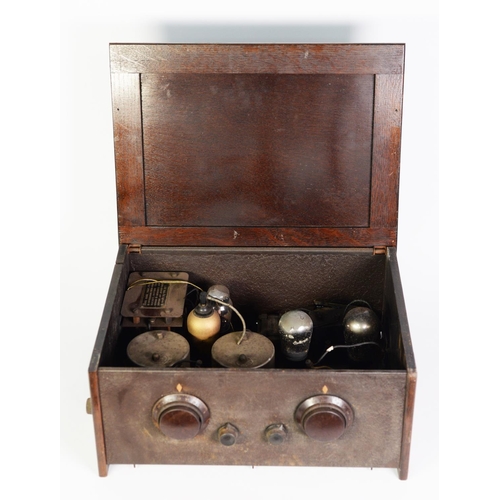 297 - VINTAGE OAK CASED VALVE RADIO RECEIVER, with two turning dials and external connectors for aerials a... 