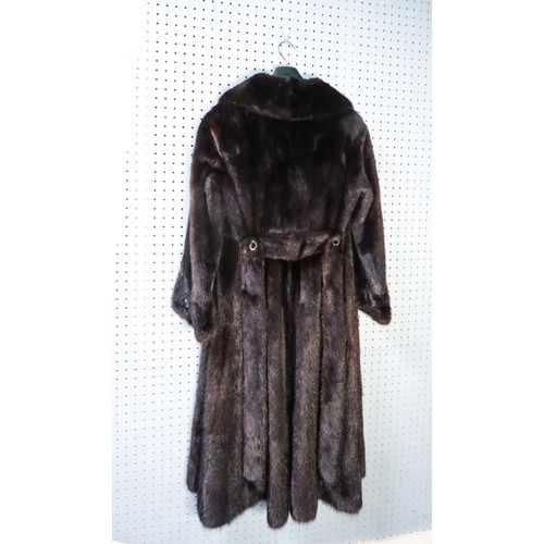 318 - LONG, FULL-LENGTH DARK BROWN MINK COAT, with short revered collar, button over cuff feature and butt... 