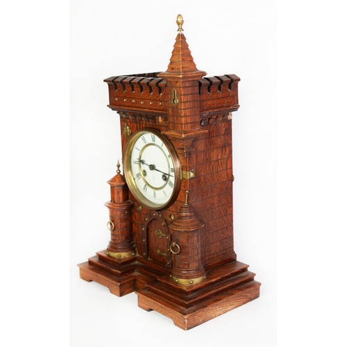 39 - VICTORIAN CASTELLATED OAK CASED MANTLE CLOCK, the 5 ½” two part enamelled Roman dial powered by a JU... 