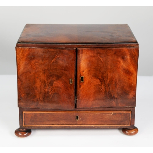 201 - EARLY NINETEENTH CENTURY FIGURED MAHOGANY TABLE TOP SMALL COLLECTORS CABINET, the moulded oblong top... 