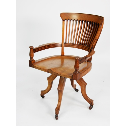 196 - GOOD EARLY TWENTIETH CENTURY SATIN WALNUT SWIVEL OFFICE CHAIR, the slat back above a pair of outswep... 