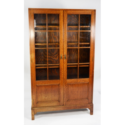 146 - GLOBE WERNICKE OAK BOOKCASE, each of the pair of cupboard doors with eight astragal glazed square pa... 