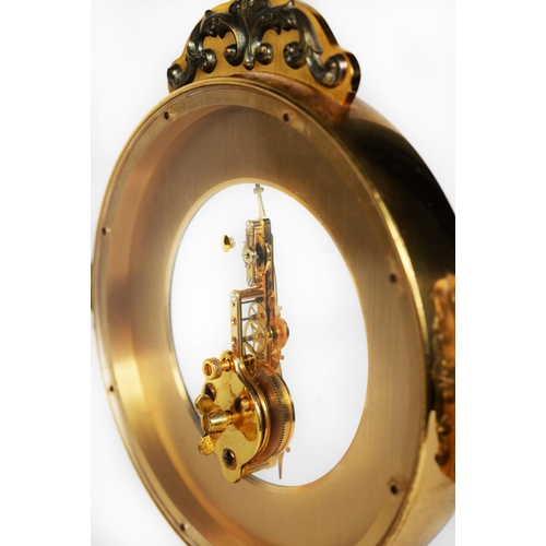 72 - JAEGER LE-COULTRE BRASS SKELETON MANTEL CLOCK, the cruciform outline case applied with cast metal sc... 