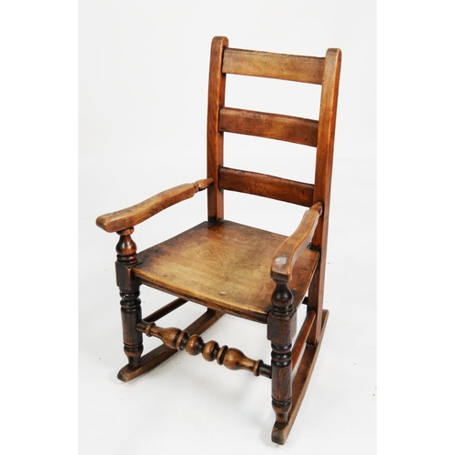 142 - NINETEENTH CENTURY CHILD’S ELM AND FRUITWOOD LADDER BACK ROCKING CHAIR, of typical form with turned ... 