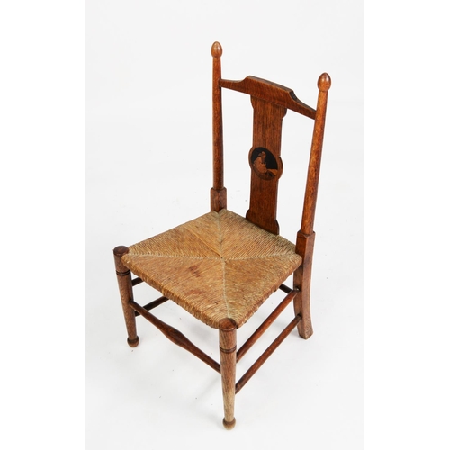 143 - NINETEENTH CENTURY CHILD’S INLAID OAK AND RUSH SEATED CHAIR, with turned uprights and pictorial inla... 