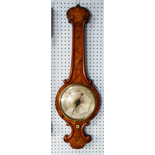 76 - VICTORIAN FIGURED WALNUT BANJO BAROMETER, with 10” silvered dial, in an arch topped case with applie... 