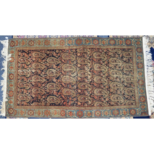 7 - SEMI-ANTIQUE EASTERN KELIM FLAT WEAVE RUG, with all-over boteh design on a black field, pale blue an... 