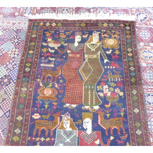 23 - SHIRAZ PERSIAN RUG featuring two male and female couples, on a midnight blue background decorated wi... 