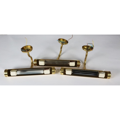 86A - MODERN GILT METAL AND GLASS CEILING LIGHT, the single bulb enclosed by three tiers of prism cut drop... 