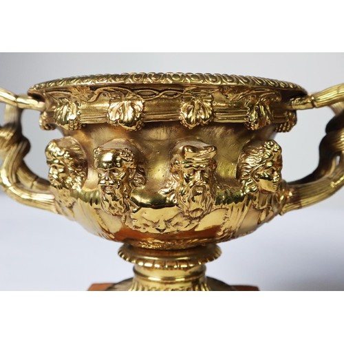 101 - PAIR OF ORMOLU TWO HANDLED WARWICK STYLE SMALL URN PATTERN RECEIVERS, each with removable liner, and... 