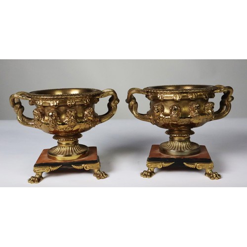 101 - PAIR OF ORMOLU TWO HANDLED WARWICK STYLE SMALL URN PATTERN RECEIVERS, each with removable liner, and... 