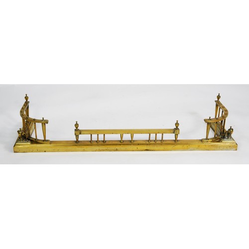 96 - LATE VICTORIAN BRASS FENDER, of tall galleried form with urn shaped finials to the fore corners, 52 ... 