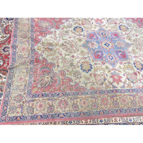 12 - KIRMAN, PERSIAN CARPET with circular and petal shaped sky blue centre medallion with pendants, on an... 