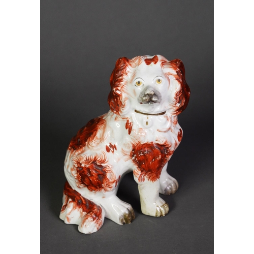 105 - VICTORIAN STAFFORDSHIRE POTTERY MANTEL DOG, modelled with front legs away from the body and with bur... 