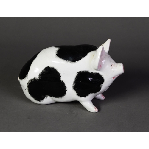 34 - WEMYSS POTTERY PIG, modelled with front legs raised, and painted with black patches and pink details... 