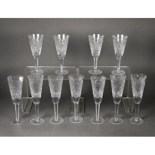 171 - SET OF SEVEN CUT GLASS CHAMPAGNE FLUTES, on hexagonally panelled tapering stems and star cut bases a... 