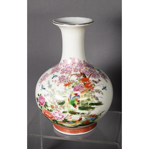 129 - JAPANESE IMARI PORCELAIN SLEEVE VASE, with flared rim, decorated with figures at leisure in a garden... 