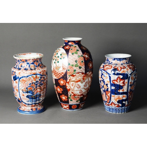 143 - THREE JAPANESE MEIJI PERION IMARI PORCELAIN VASES, one of ovoid form, decorated with panels depictin... 