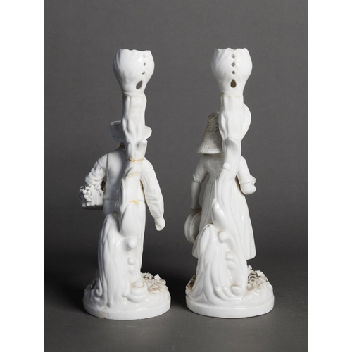 49 - PAIR OF NINETEENTH CENTURY DERBY WHITE GLAZED PORCELAIN FIGURAL CANDLESTICKS, modelled as a rustic c... 