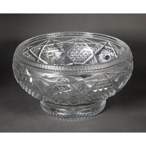 175 - TWENTIETH CENTURY HEAVY CUT GLASS LARGE BOWL, of footed form, with star cut base, 6 ½” (16.5cm) high... 