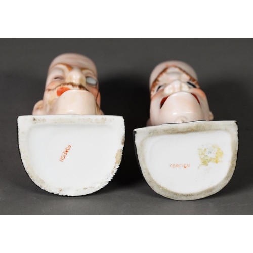 100 - A PAIR OF PORCELAIN SMOKING HEAD ASHTRAYS, by Schafer & Vater; 'For he's a jolly good fellow' an... 